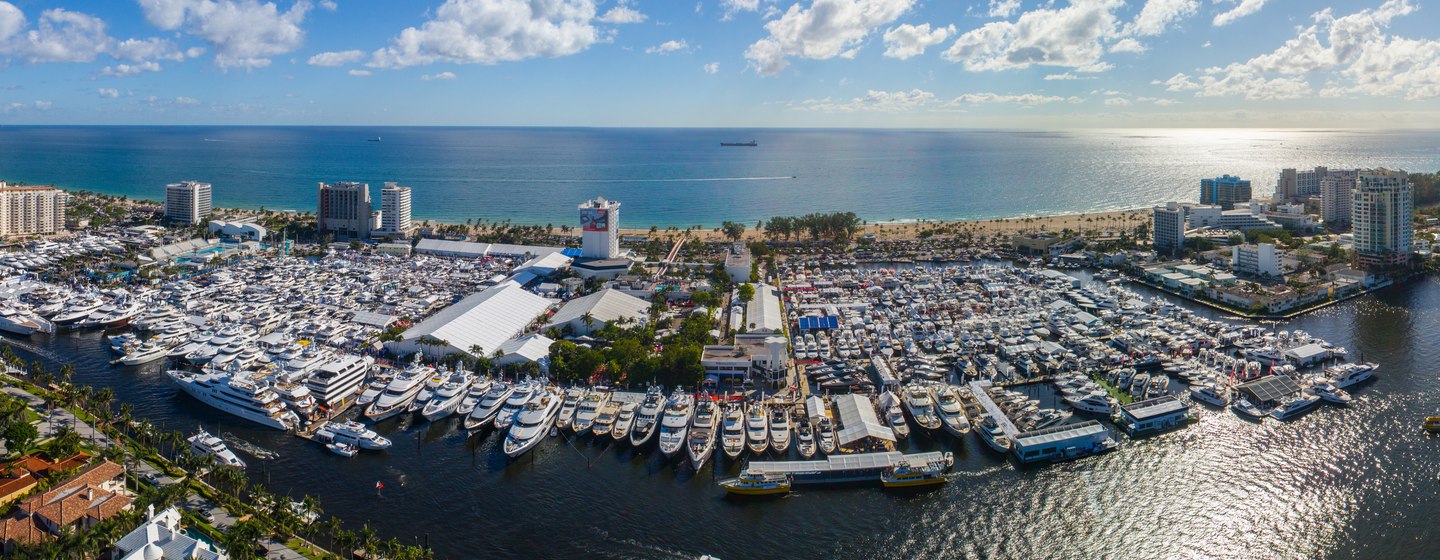 Aerial view of FLIBS, hundreds of yachts at anchor, surrounded by sea on the horizon