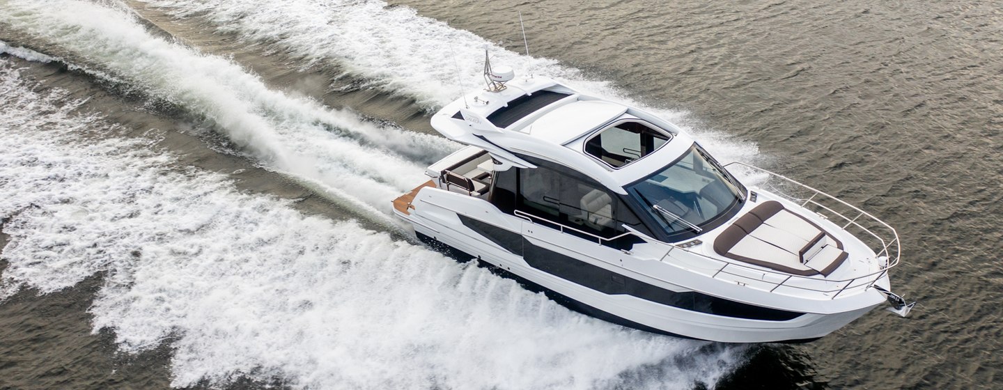 Galeon 410 HTC moving at speed on water