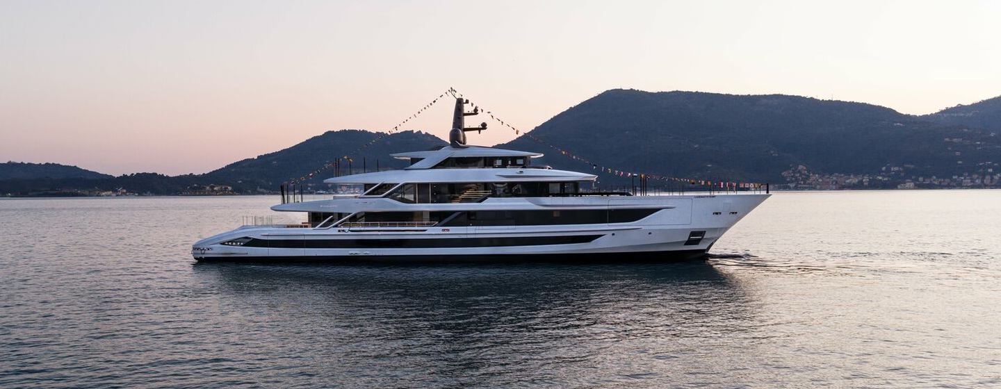 Baglietto T60 Superyacht Kinda II with bunting at anchor 