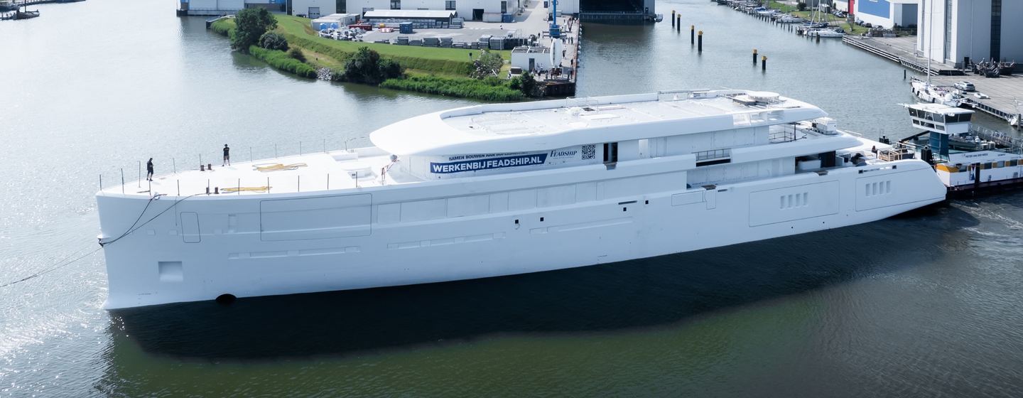 Feadship 1015 superyacht pre-outfitting docked outside Feadhsip shipyard 