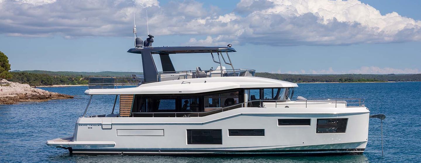 Beneteau Grand Trawler 63 motor yacht at anchor side view