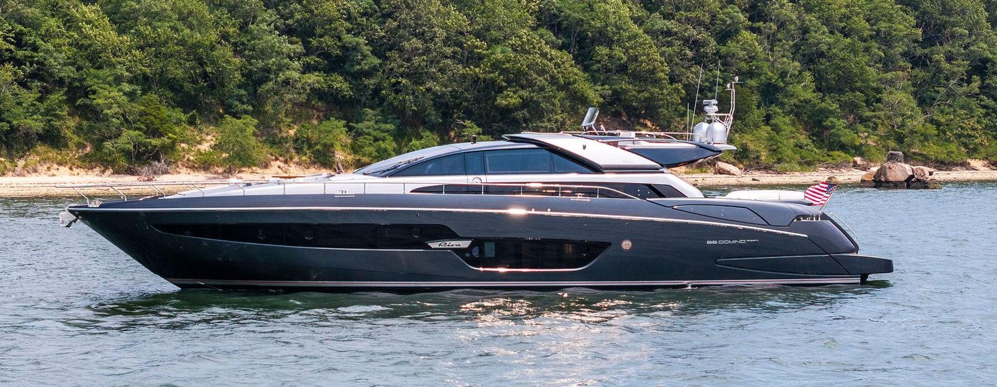 Riva motor yacht Indiscretion at anchor side view 