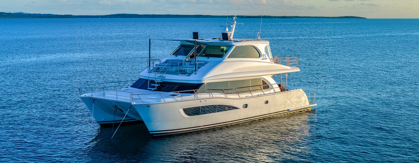 Horizon PC60 catamaran at anchor side view 