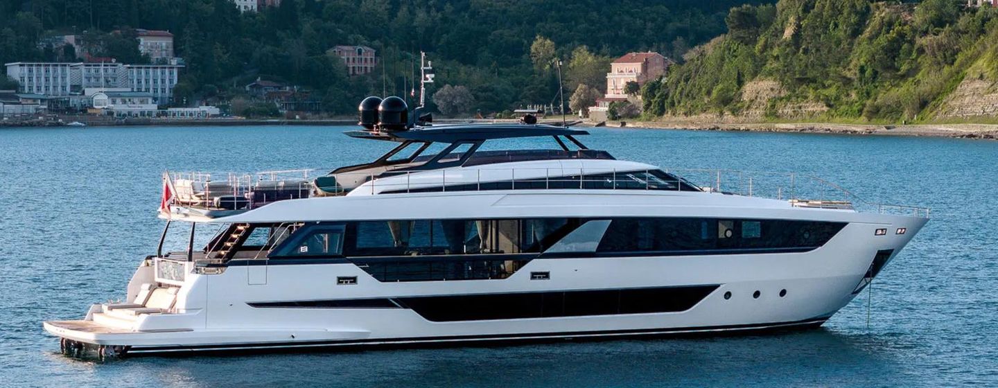 Ferretti motor yacht Isotta at anchor side view 