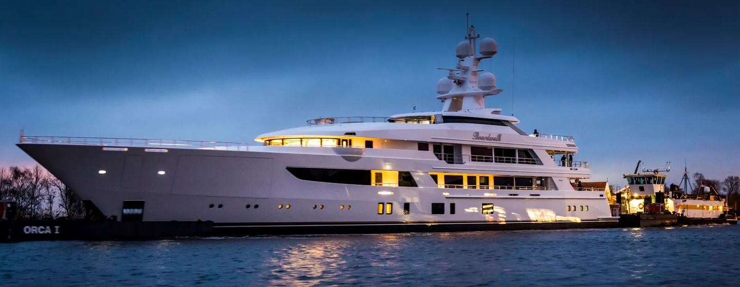 Superyacht Boardwalk V at anchor at night
