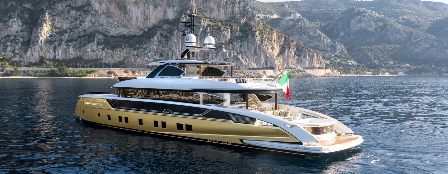 Dynamiq superyacht STEFANIA on water with coast in background