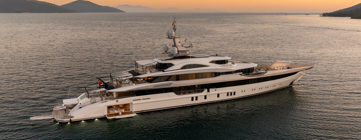 Bilgin 263 Superyacht Al Reem at anchor with fold our beach club balcony and sunset