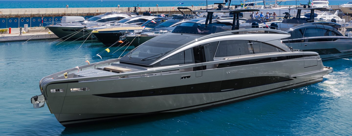First Pershing GTX90 motor yacht at anchor side view 