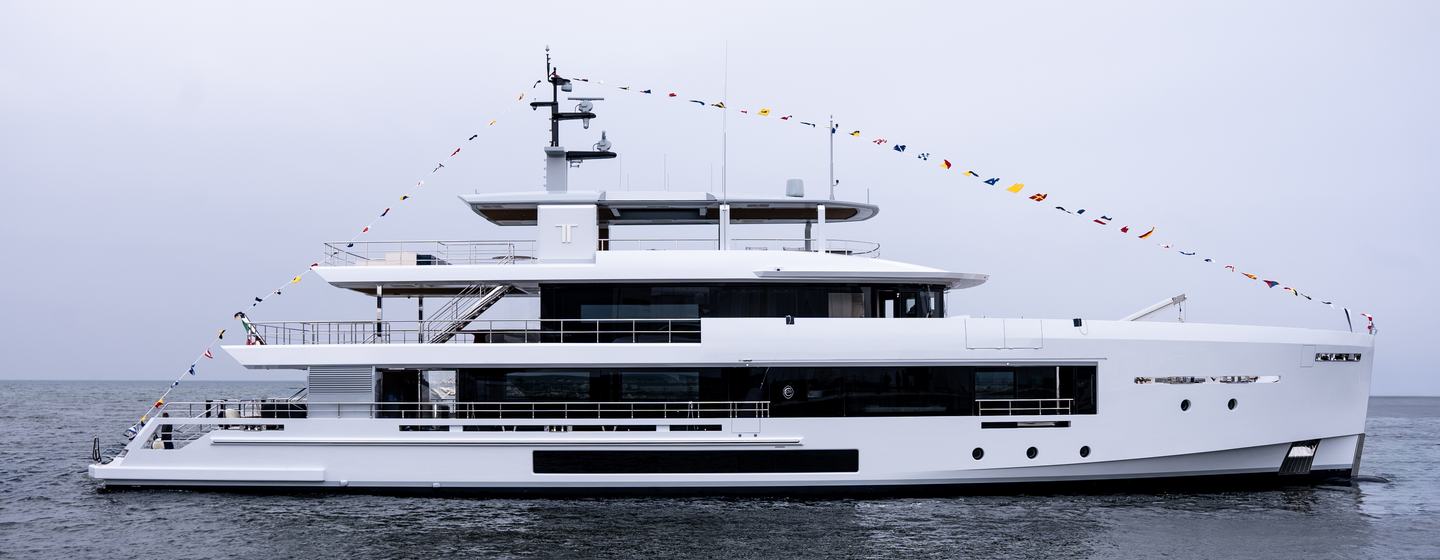 Explorer yacht TREMENDA at sea after launch showing her starboard side and expansive sections of glazing