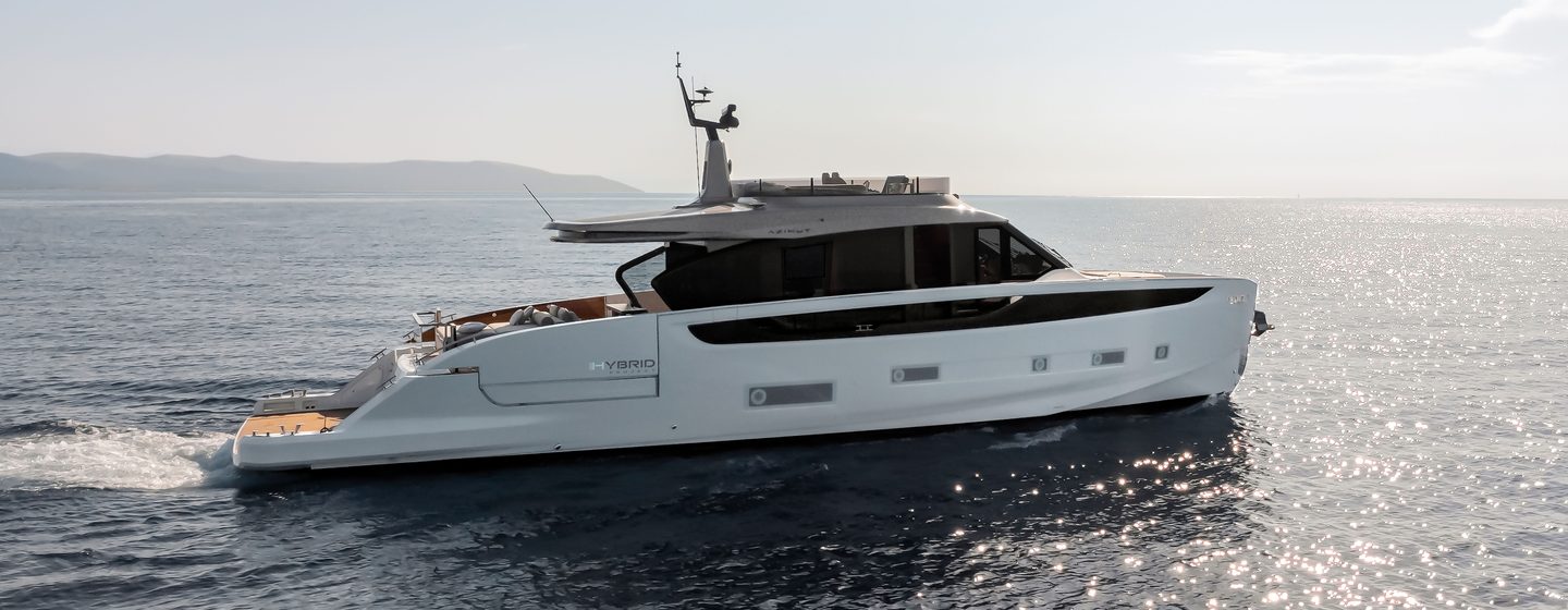 Azimut Seadeck 7 motor yacht running shot on calm water on bright day, starboard profile mid aerial shot