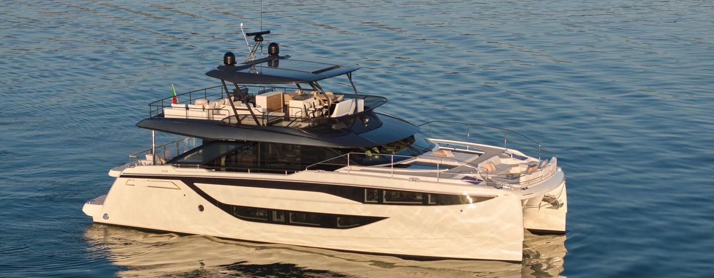 Prestige M8 Evo motor yacht at anchor side view 
