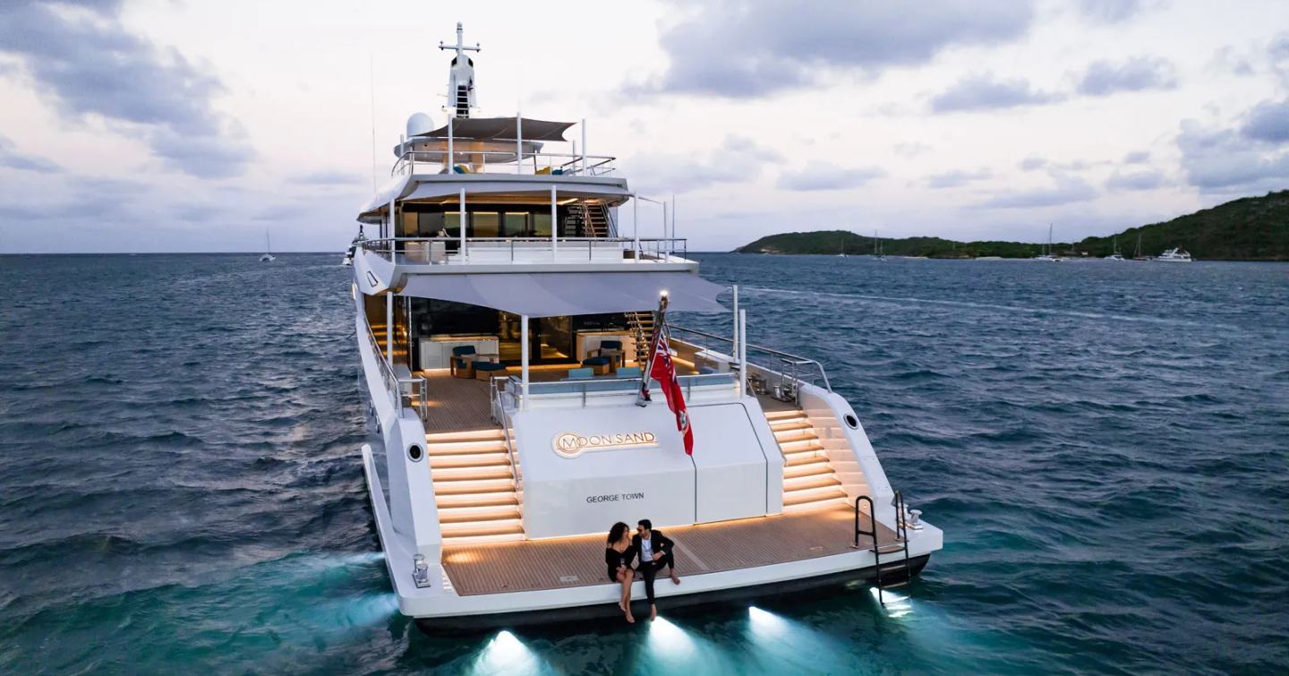 Couple sitting on Motor yacht Moon Sand's aft