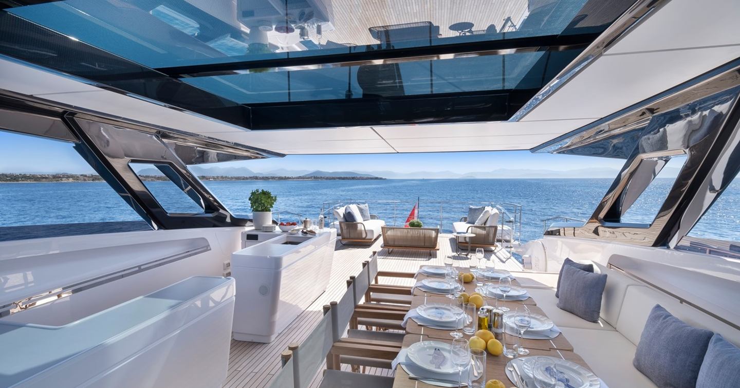 Motor Yacht Spica's flybridge with shaded dining table 