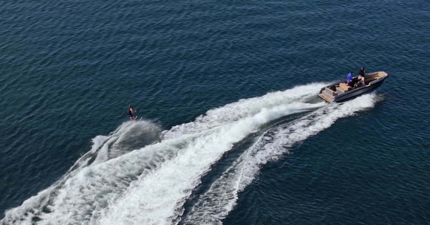 Evene Origin 71 towing a waterskier in Studland Bay