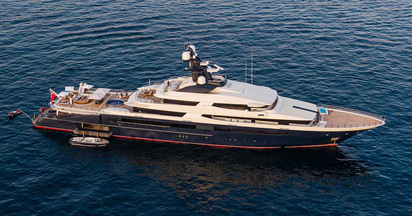 Aerial view of Superyacht TRANQUILITY underway, surrounded by sea.