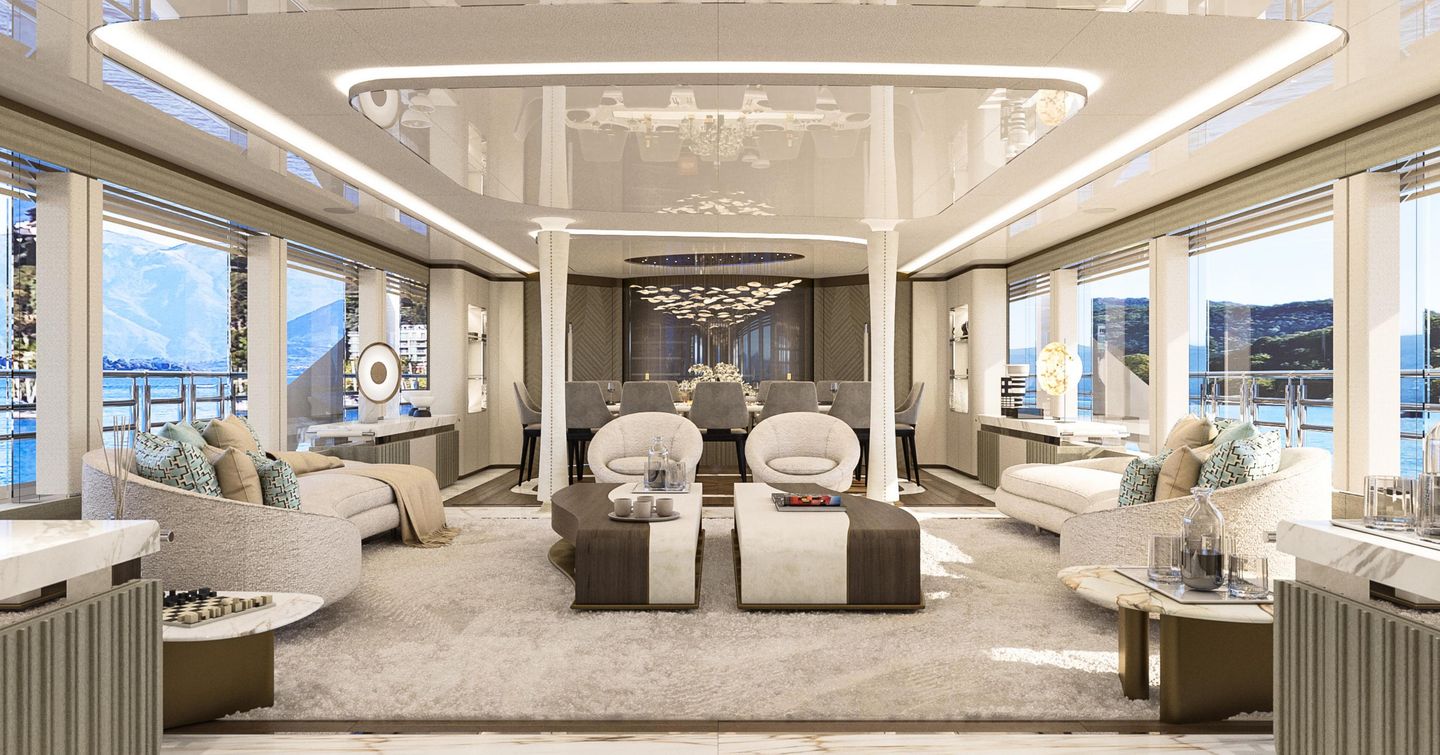 Superyacht Camilla saloon with white furniture and aft dinner area 