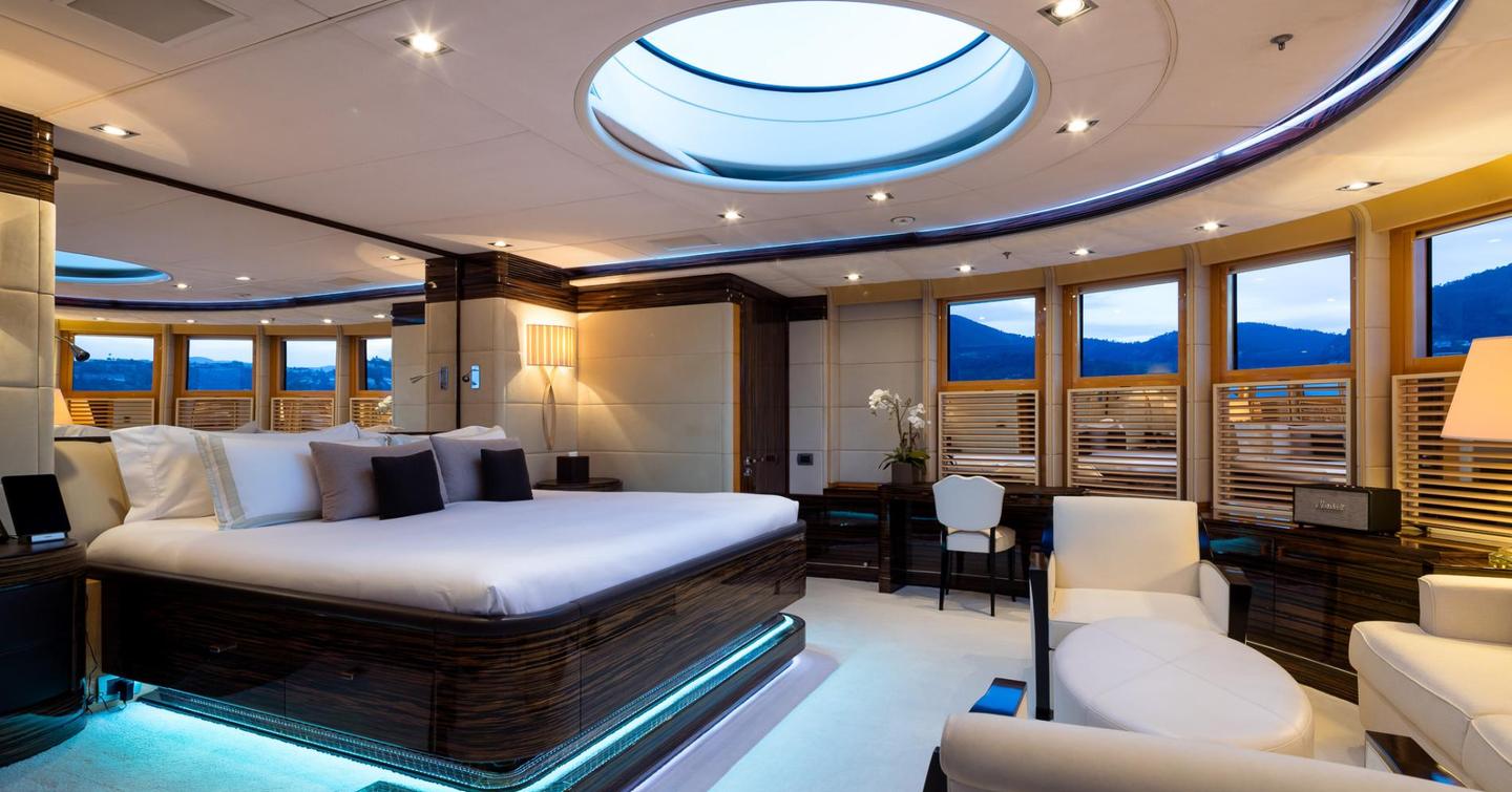 Owner's suite on board Vision, with floor to ceiling windows and a skylight