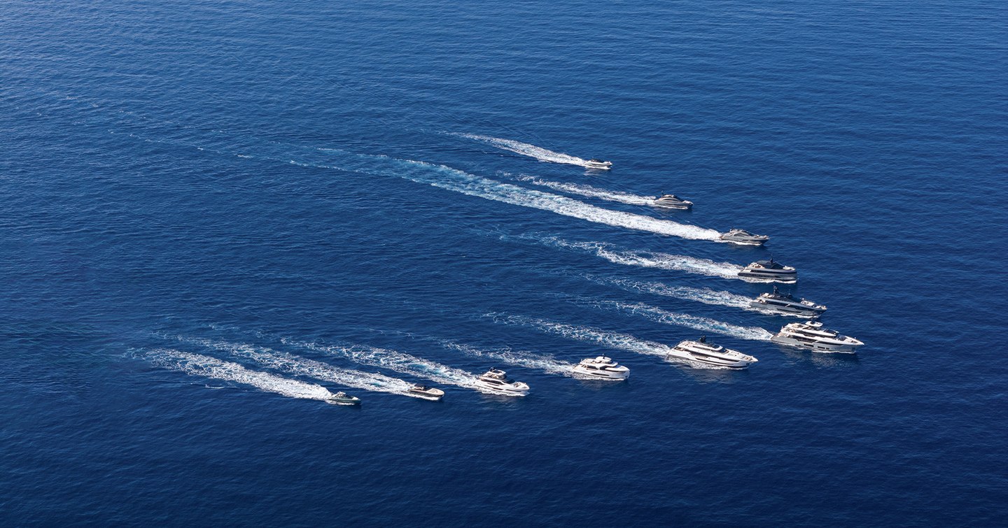 Superyachts in V shape under way 