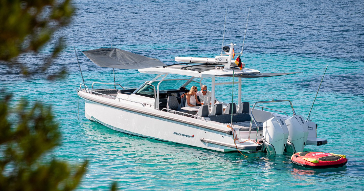 Axopar 37 Sun-Top boat  at anchor 