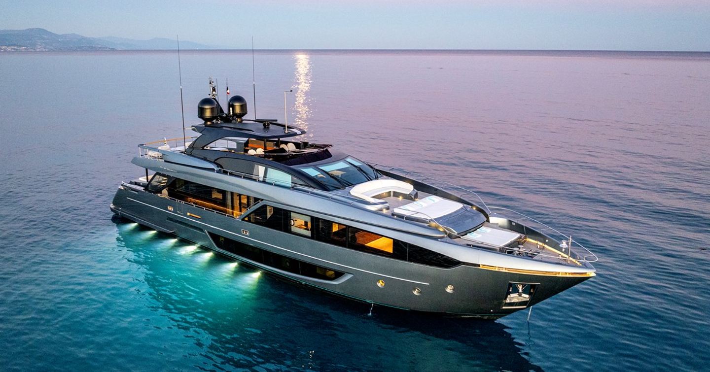 Superyacht Taku at dusk with underwater lights