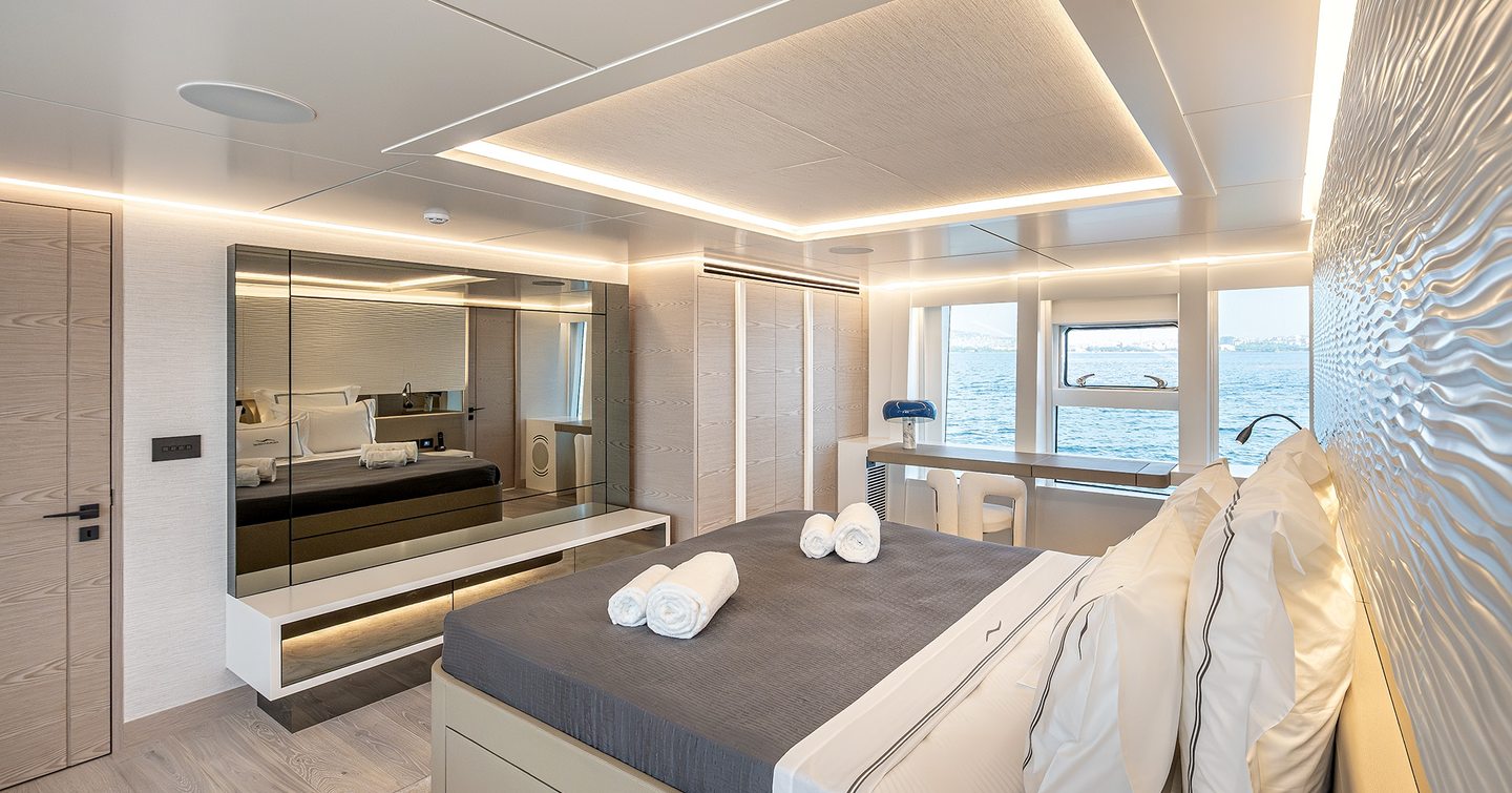 Numarine 40MXP main deck owner's cabin with panoramic windows, sofa and dressing area