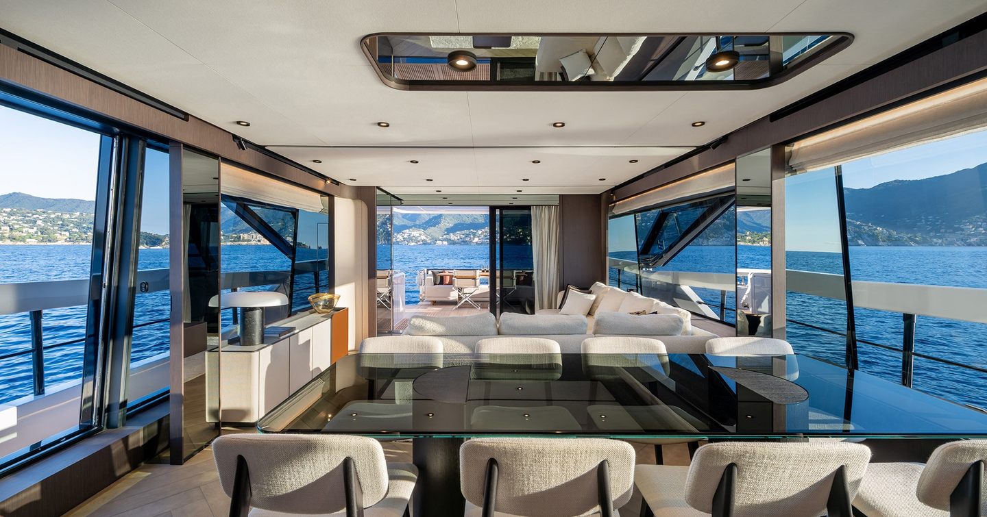 Ferretti 800 motor yacht saloon with glass forward dining area 