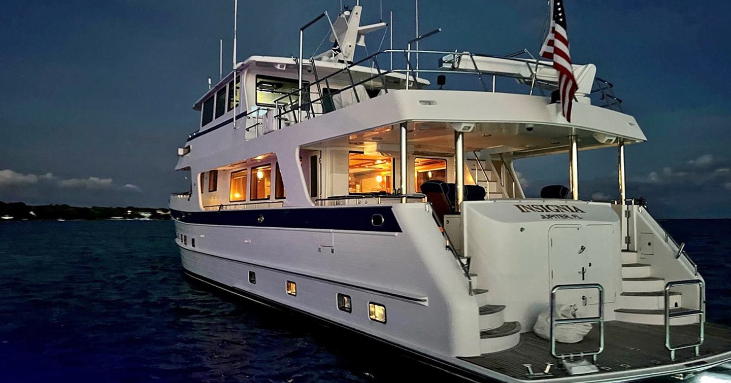 Motor Yacht Insignia aft at night on water