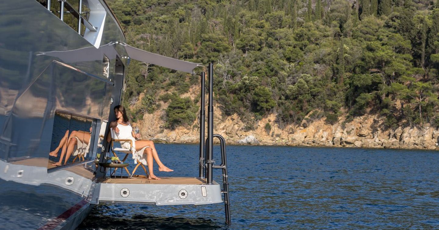 Woman on balcony of Sirena 118 Superyacht IKIGAI