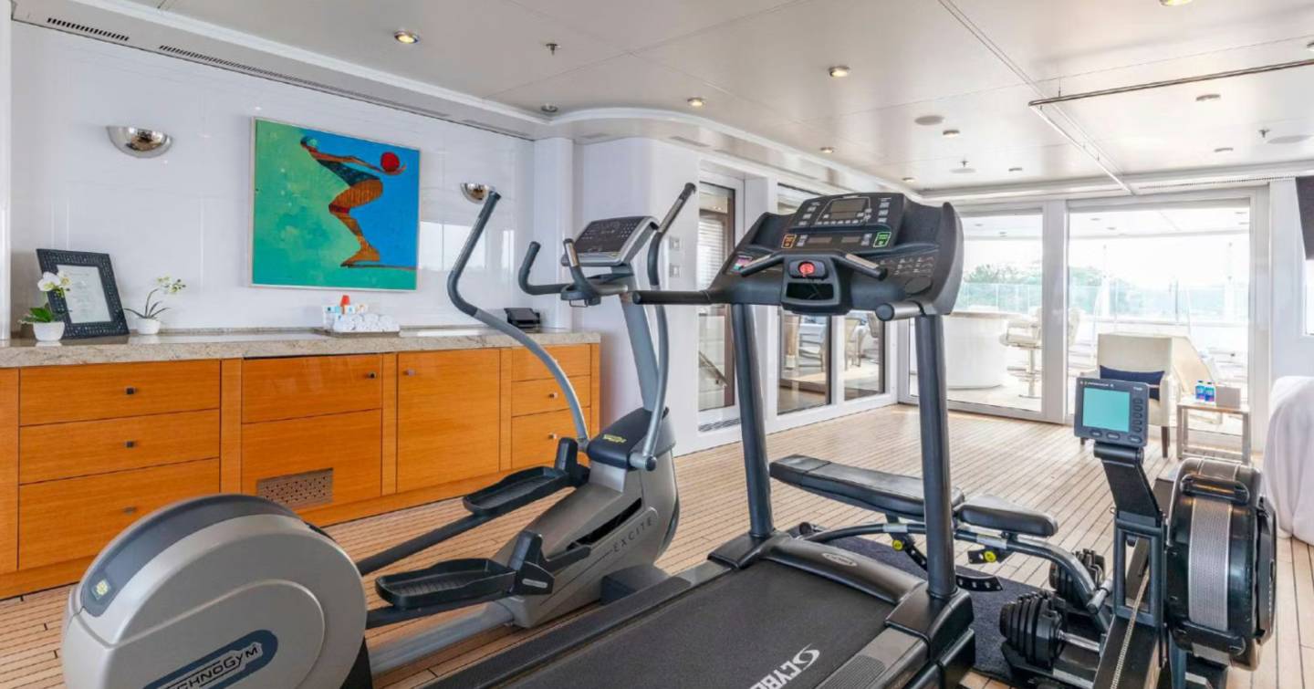 Superyacht Bella Vita indoor gym with treadmill and spin bike 