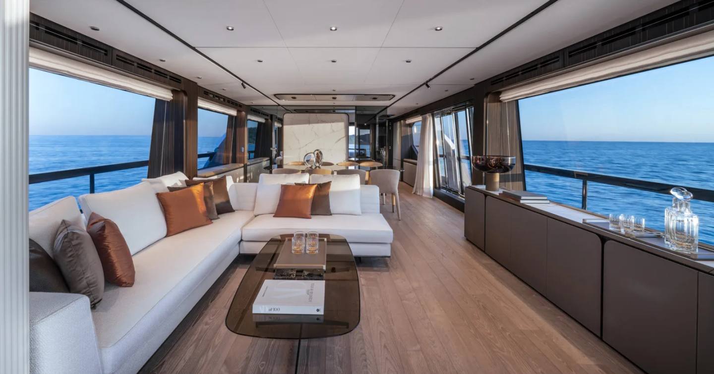 Ferretti 940 motor yacht main saloon with L-shaped sofa 