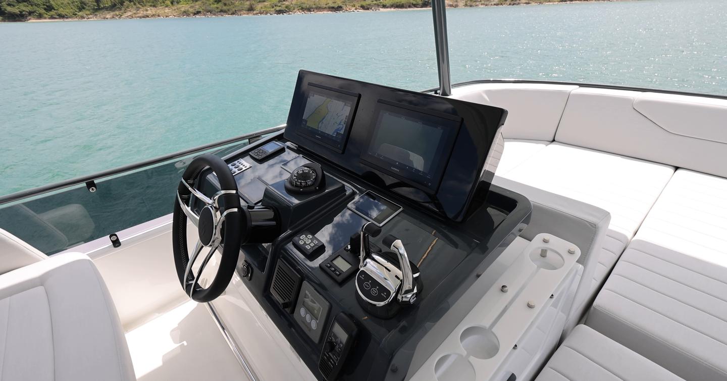 Sirena 48 flybridge helm with twin Garmin displays and throttles