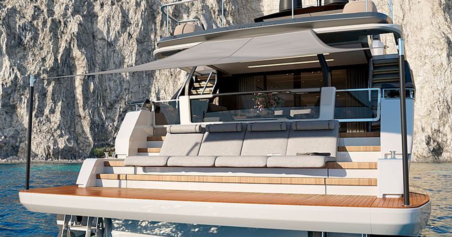 Aft deck of Ferretti 1000 with extending canopy centre and swim platform, with cliffs in background