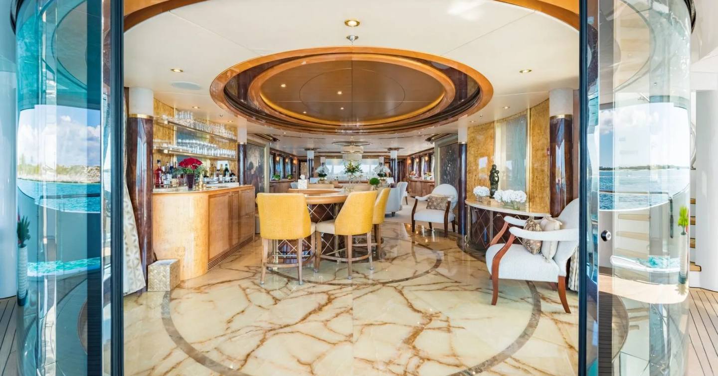 Superyacht Elis Et Mar main saloon bar area with curved glass sliding doors and bar area 