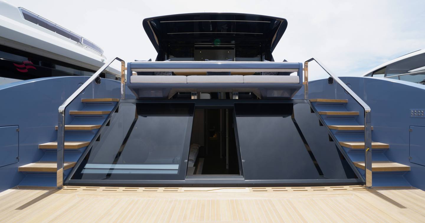 Manda S07 Berlinetta owner cabin glass doors opening directly onto the aft deck terrace