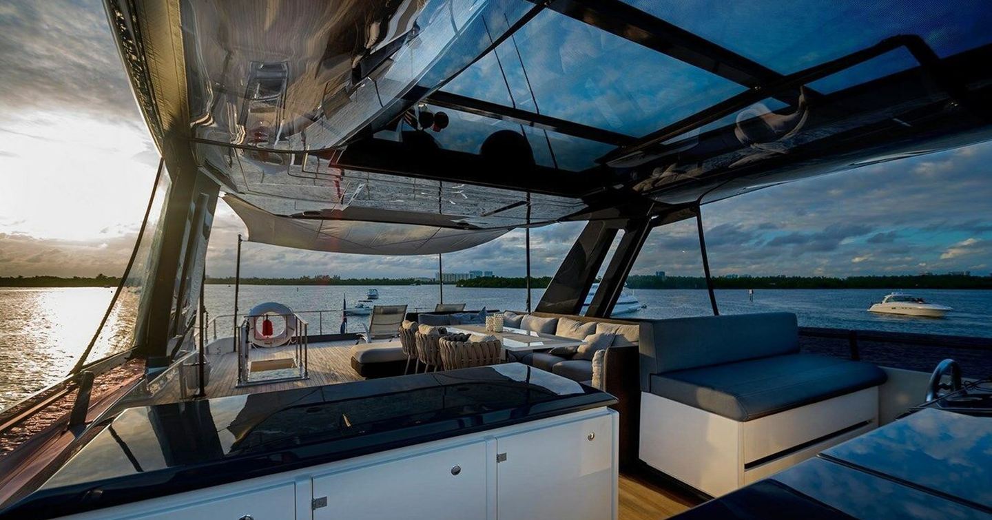 Motor yacht Alter Ego sundeck with shaded seating and helm station