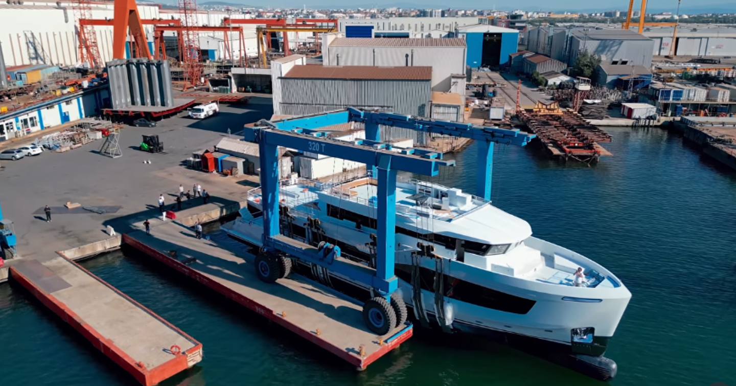 Explorer Yacht Mitan being lowered into water at launch