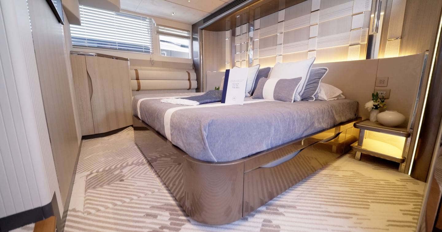 Owner’s cabin aboard the Galeon 620 Fly with hull glazing, double berth and soft indirect lighting.
