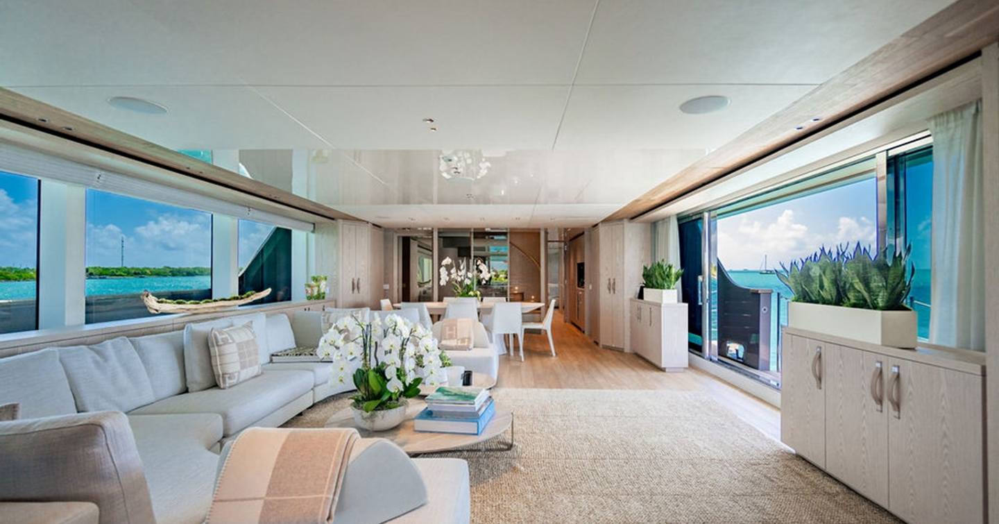  Superyacht The Wolf main saloon with L-shaped seating and circular dining table