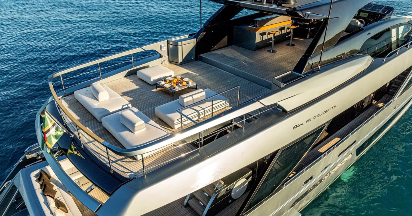 Superyacht Taku flybridge with sunpads and hardtop