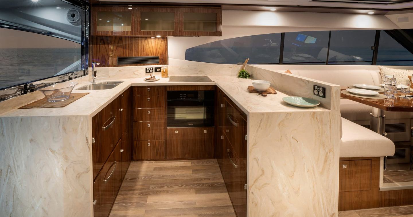 Riviera-6000-Sport-Yacht-Platinum-Edition-Review-galley-with-stone-worktops-and-storage