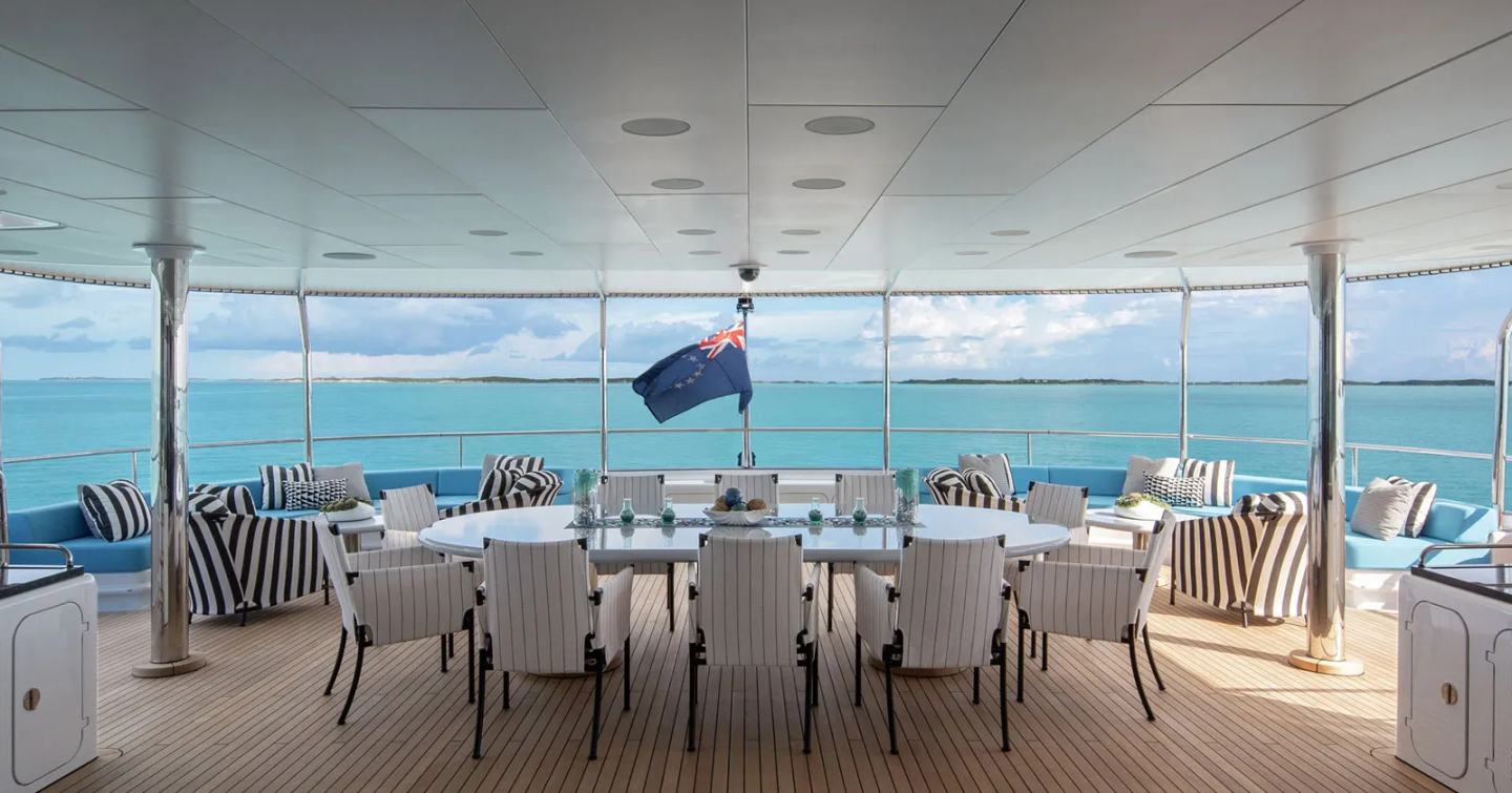 Superyacht Eternity's upper deck outdoor dining area