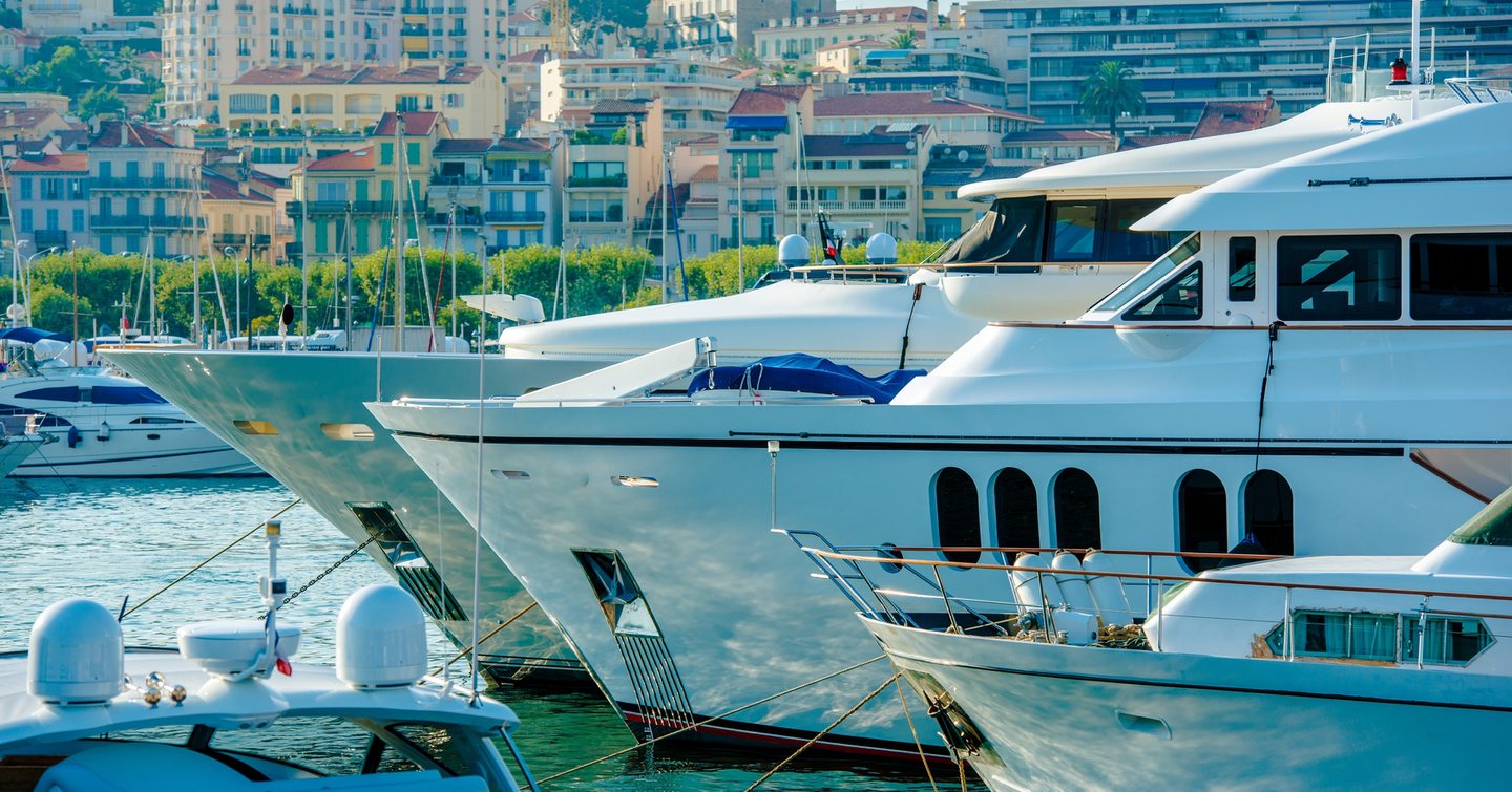 Yachts moored in a row at a marina 