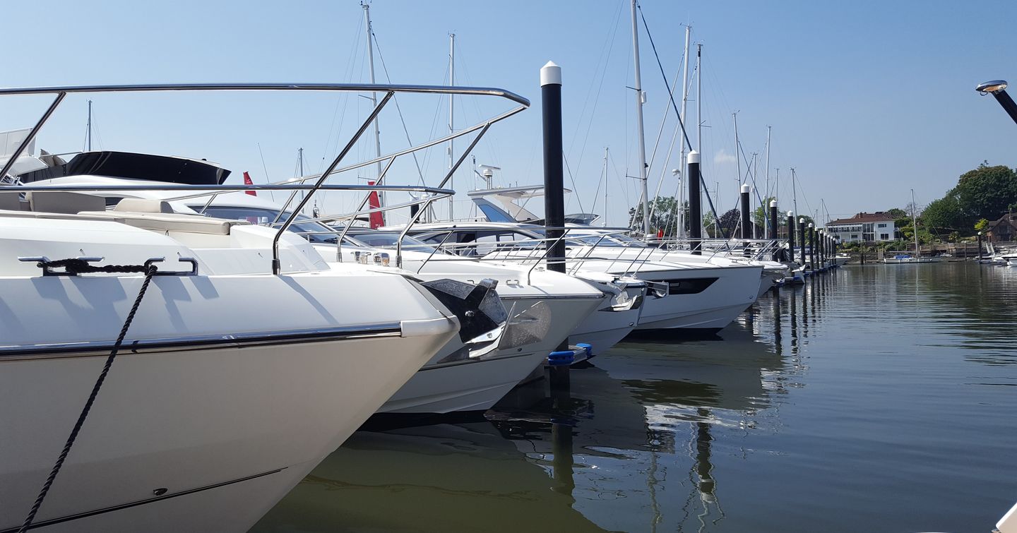 Line up of motor yachts moored at British Motor Yacht Show