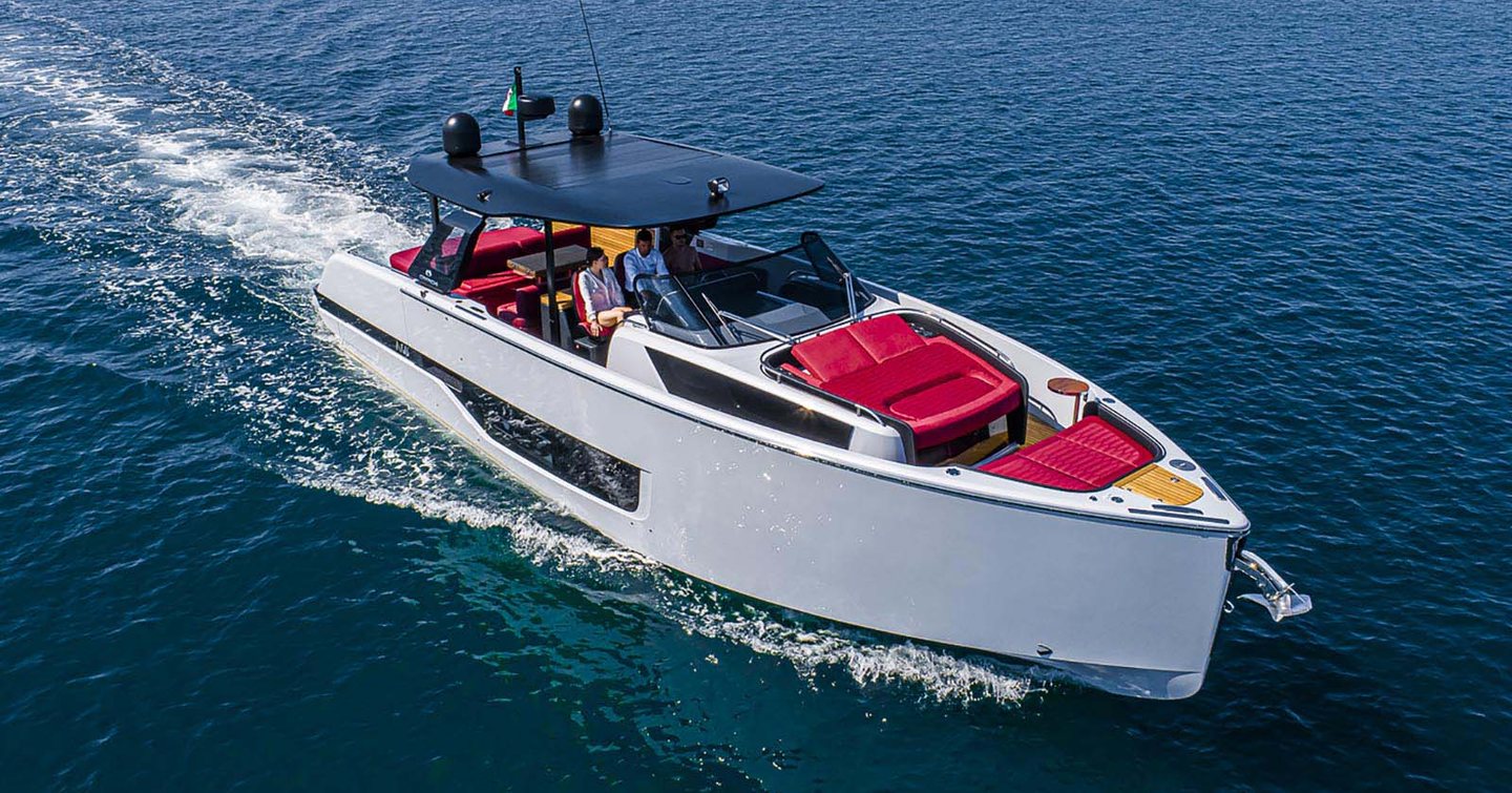 Couple at helm of A46 Luxury Tender on open water