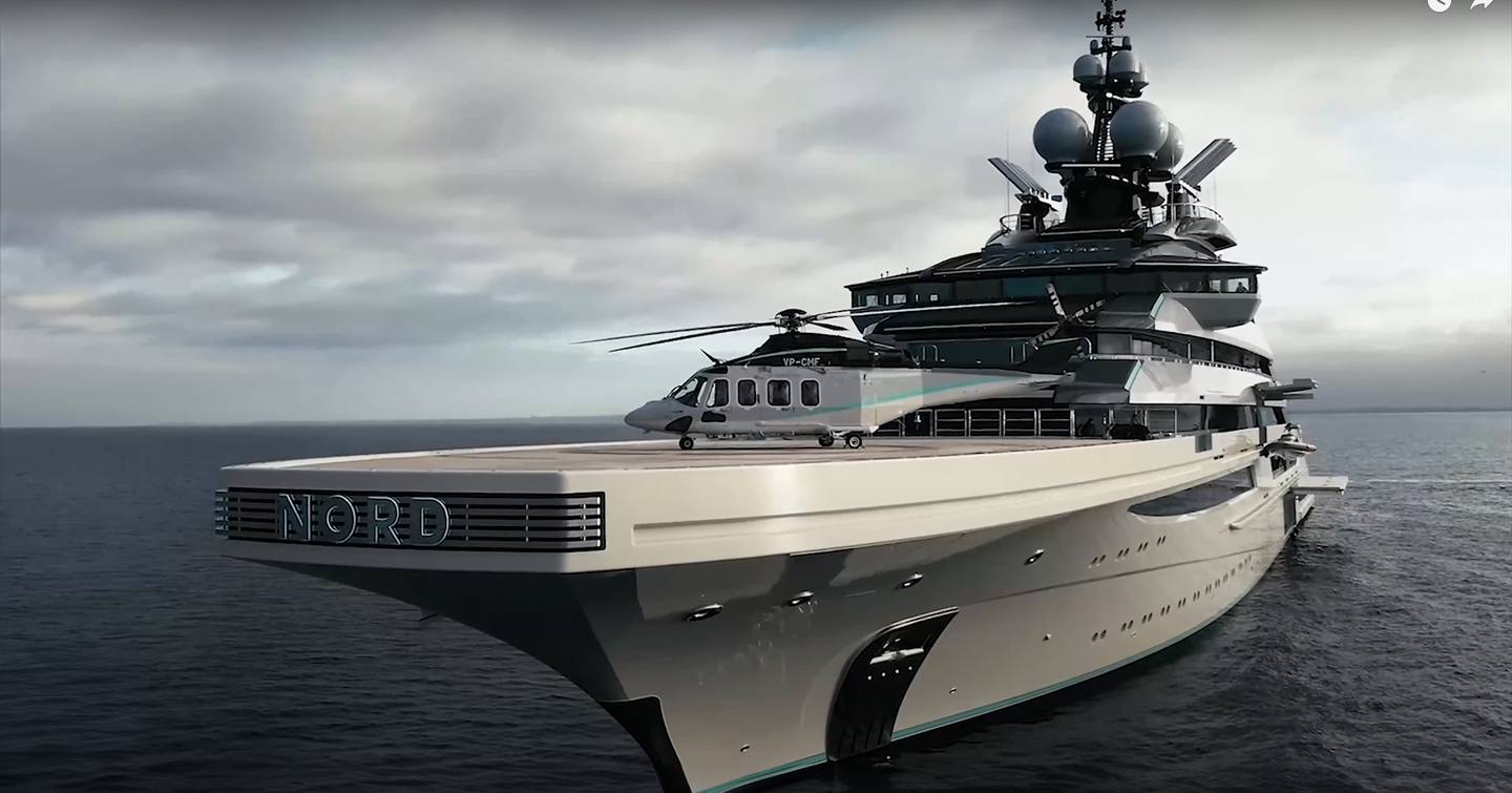 Close up of helicopter on foredeck helipad of superyacht