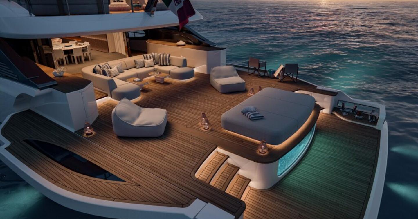 Aft deck of motor yacht Benetti Oasis 42M at night, with illuminated pool and modular seating 