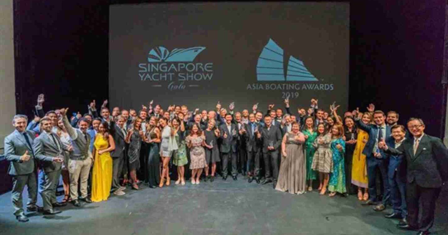 Group photo of all the winners at the 2019 Asia Boating Awards, holding up trophies.