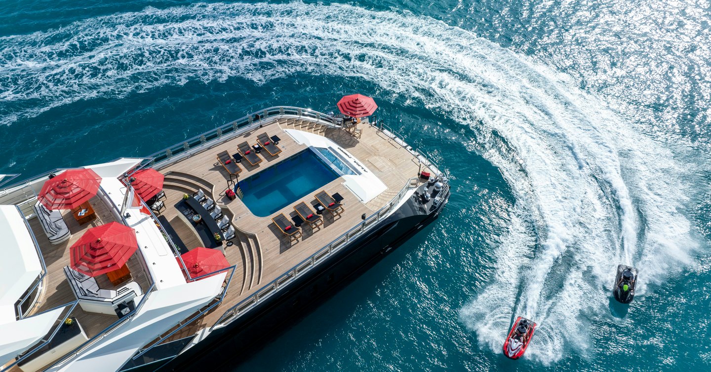 Aerial view of WaveRunners zooming around aft of Alfa Nero yacht