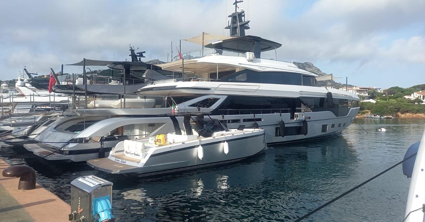 Azimut Grande Trideck Superyacht Blue Eyes docked next to tender 