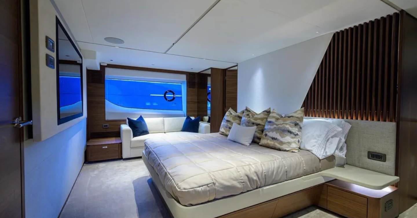 Bedroom with sofa onboard Motor Yacht Escape 